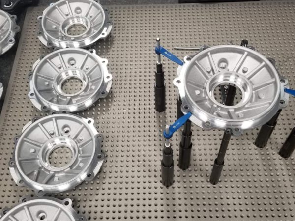 A CMM manager prepares parts for inspection