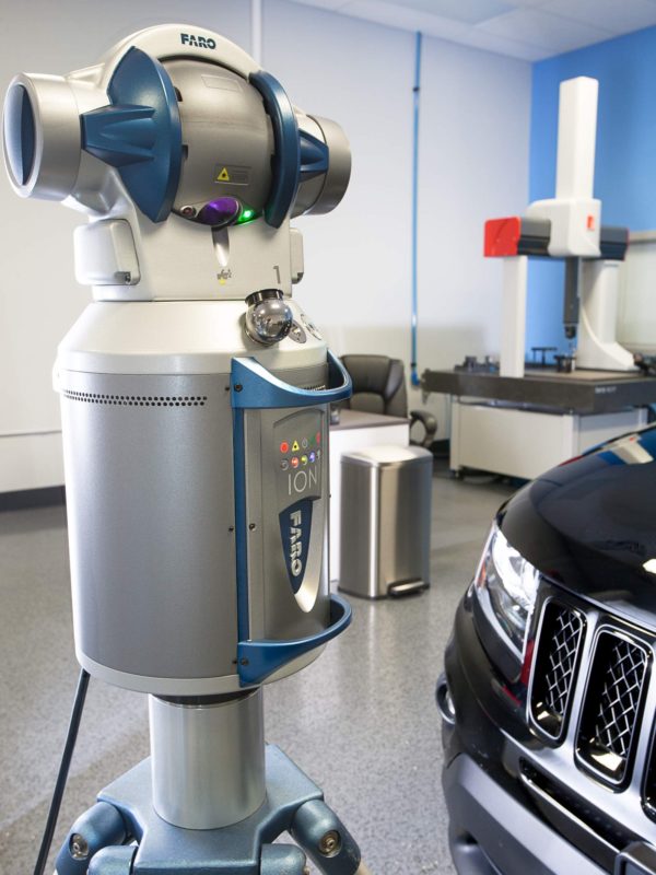 Faro 3D laser tracker inspecting an automobile in the metrology lab